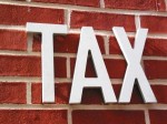 tax sign on a wall